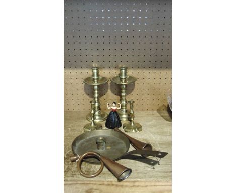 A vintage Bakelite windup toy in the form of a female flamenco dancer holding maracas (key present) together with a large bra