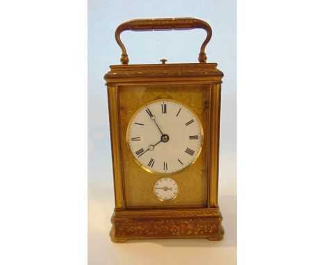 A French engraved gilt brass carriage clock with fully engraved gorge case with alarm and repeat, by Drocourt of Paris, movem