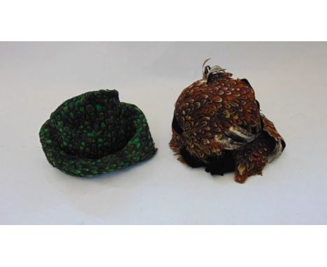 A ladies vintage hat decorated with brown pheasant plumage, bearing a label to interior Claude Saint Cyr, Paris and London, t