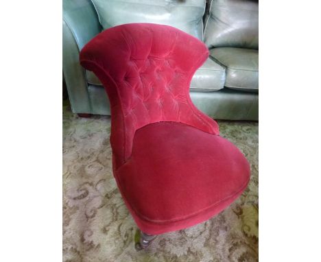 A Victorian occasional/nursing chair, with upholstered finish, waisted buttoned back and turned tapered walnut forelegs with 