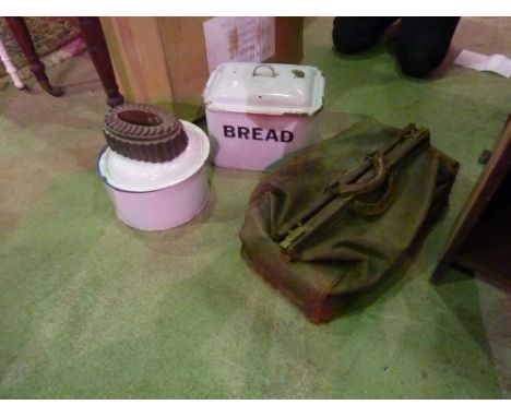 A 19th century copper jelly mould of oval form, a vintage leather gladstone bag, a white enamel bread bin and two further ena