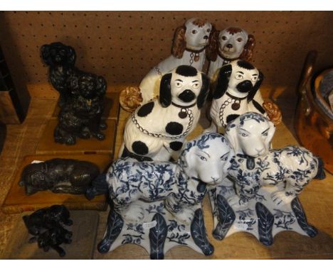 Two reproduction pairs of Staffordshire type ceramic spaniels together with a further blue and white pair, also together with
