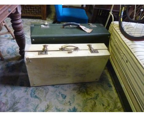 A vintage vellum suitcase together with one other