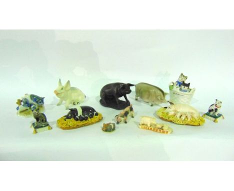 A collection of ceramic and other models of pigs including a Beswick seated humorous sow with printed and impressed marks to 
