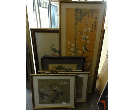 A collection of oriental pictures and prints including a watercolour of a bird amongst prunus blossom, a pair of studies of c