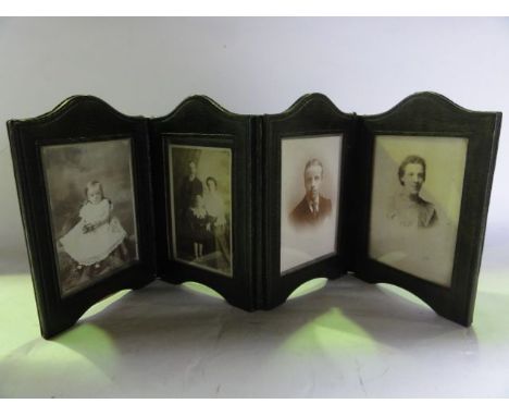 A four divisional Victorian green stained leather photo frame folding assembly containing a portrait and group photographs