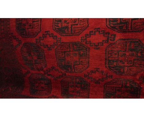 An eastern wool rug showing architectural detail of buildings, etc, set within further geometric borders, 170 x 115 cm approx