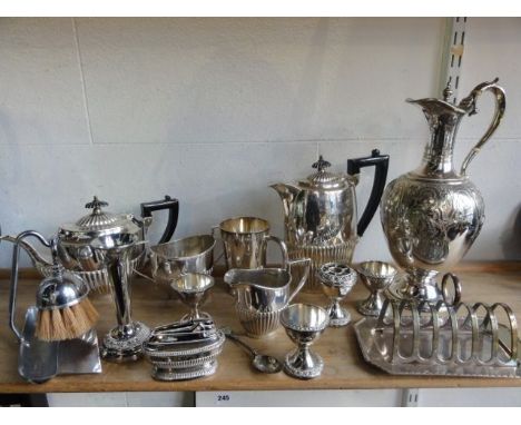 A four piece silver plated tea set comprising teapot, hot water pot, sugar basin and milk jug, all with vertical banded detai