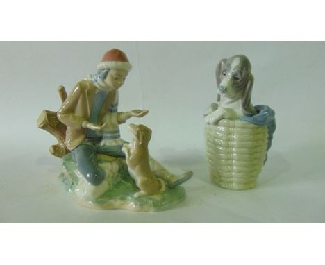 A Lladro model of a doleful long eared puppy in a basket with printed mark to base together with a Nao group of a boy in hat 