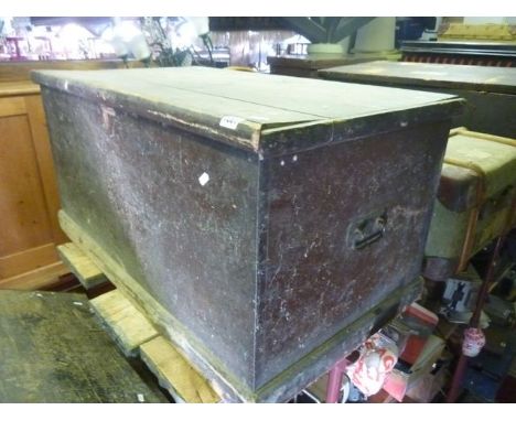 A Victorian stained pine blanket box with hinged lid and iron work carrying handles together with a vintage green canvas fibr