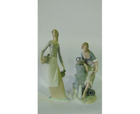 Two Nao figures, one of a young woman at a water fountain washing her feet, the other of a young woman holding water bottles