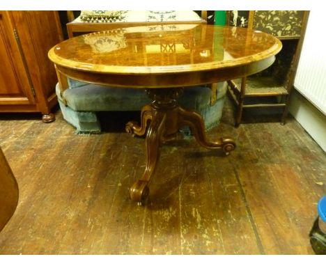 A good quality Victorian walnut and burr walnut occasional table, the circular snap top raised on a carved and fluted column 