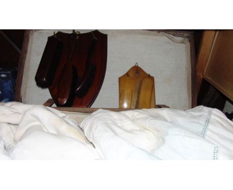 A large vintage stitched leather suitcase containing a quantity of good quality antique and later white domestic linen, table