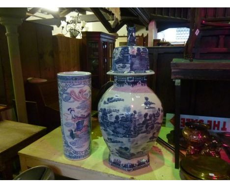 A contemporary oriental outsized blue and white ceramic vase and cover with dog and fo finial together with a further contemp