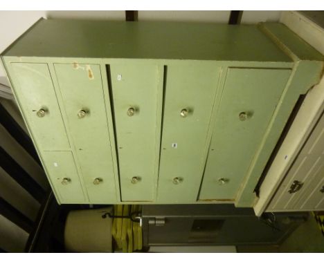 A vintage pine chest of four long and two short graduated drawers with all over mint green painted finish