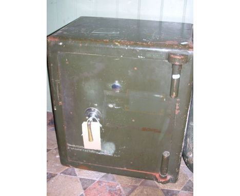 A vintage green painted steel safe enclosed by a single door, stamped C S Echo?? 1953, etc, 52  cm wide x 40 cm deep x 58 cm 