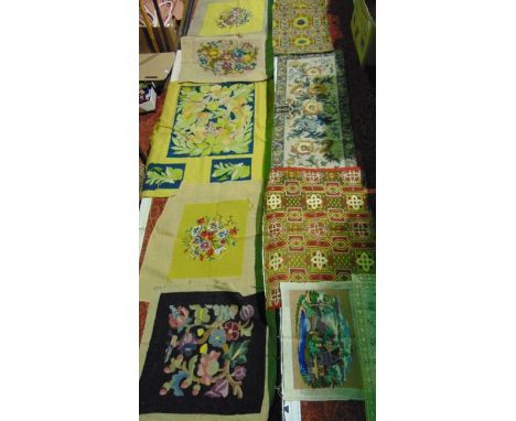 A box containing an assortment of vintage hand embroidered and cross stitched panels to include examples with foliate and flo