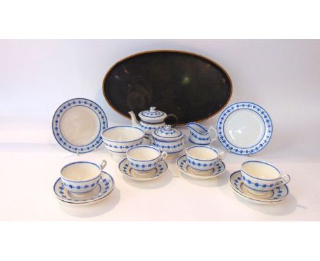 A collection of 19th century blue and white painted childs tea wares, including teapot, milk jug, covered sucrier, slop bowl,