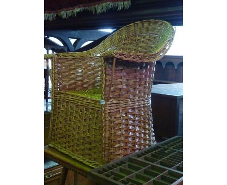 A wicker tub chair with shaped outline together with a vintage printers type tray and a simple mahogany framed hanging corner