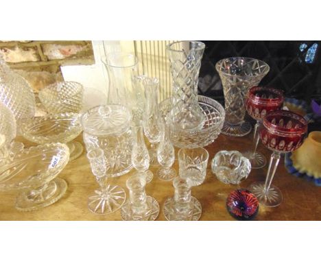 A selection of clear cut glassware to include a Waterford crystal lidded biscuit jar, a Waterford bowl with vertical cut bord