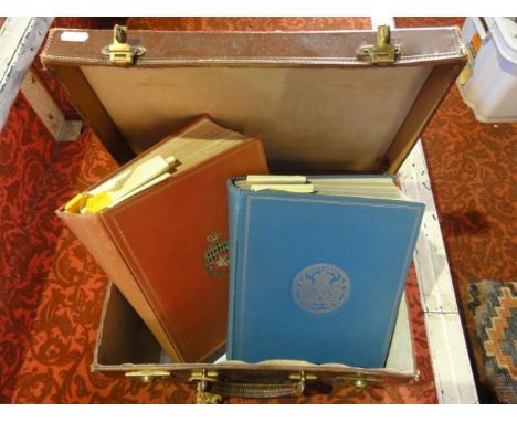 A small vintage stitched leather suitcase of squared form with brass dual levered locks containing volumes titled The Authent
