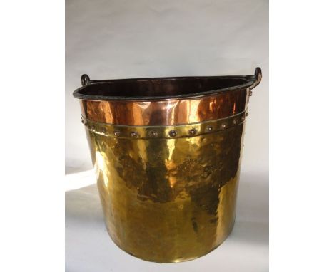 A good quality 19th century fireside hopper, principally in brass with copper studding and copper rim supporting a looping ir