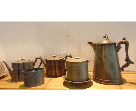 A large covered pewter jug of tapering cylindrical form with all over machine worked detail to the bowl, the lid with an appl