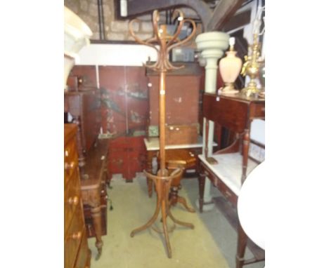 A vintage Bentwood half hat/coat stand of full height raised on three swept supports 