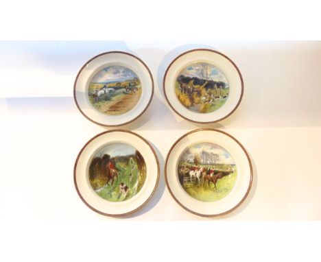 An unusual set of four Copeland soup plates with printed and painted decoration designed by Lionel Edwards, all showing hunti