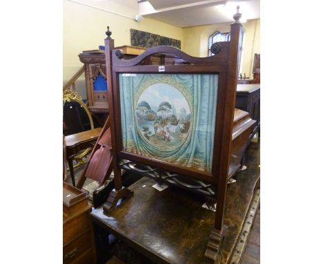 A 19th century mahogany fire screen incorporating a 19th century watercolour panel showing an extensive estate of 18th centur
