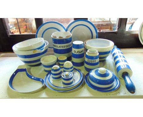 A collection of T G Green blue and white banded Cornish kitchen wares including a rolling pin, a butter dish and cover of cir