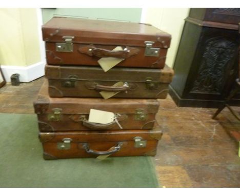 Four vintage good quality heavy gauge tan leather suitcases with reinforced corners