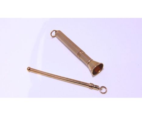 A 9ct gold cigar piercer, with engine-turned decoration, 11g; and a gold coloured unmarked swizzle stick (2)