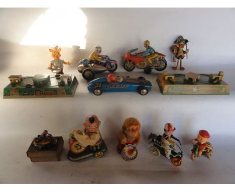 A selection of vintage toys to include a pair of clockwork printed tin models of lapping trains and vehicles entering sheds, 