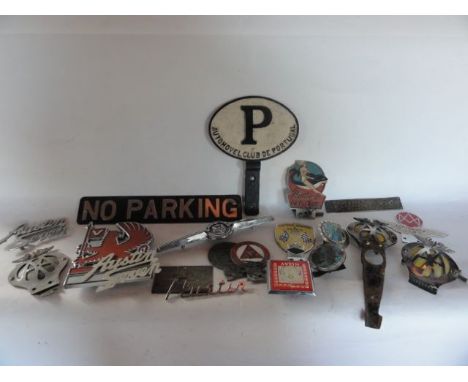 A collection of automobile radiator badges to include a Morris badge, an enamelled Butlins Car Club example, a British Racing