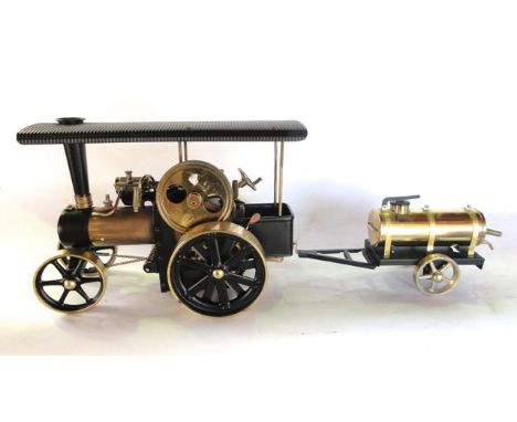 A boxed Wilesco model steam roller traction engine with working components, made in West Germany, together with an associated