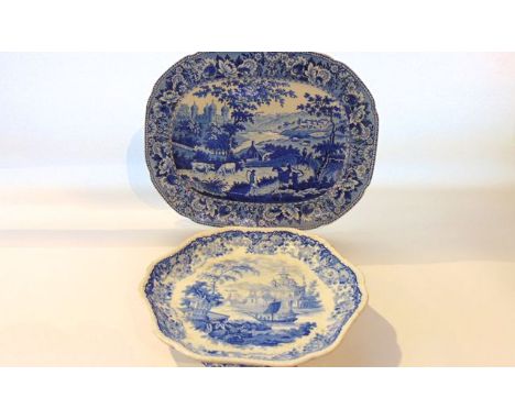 An early 19th century blue and white printed meat plate of oval form with central panel showing an extensive landscape with f