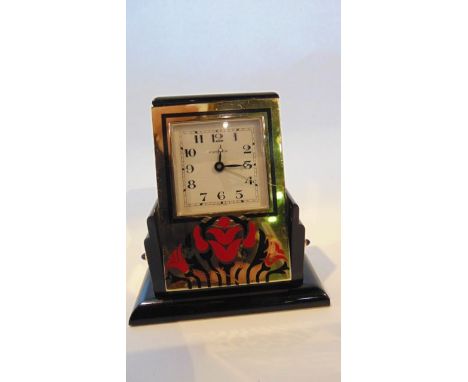 An Art Deco design Cartier Basculante alarm desk clock with quartz alarm movement, the gilt case with red and black lacquer f