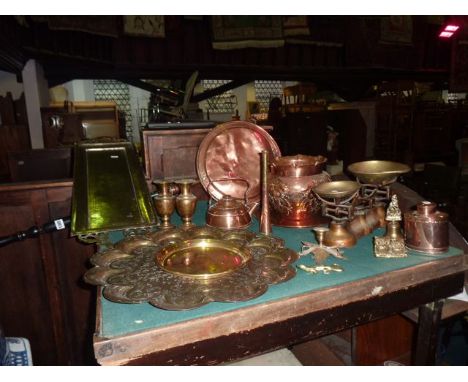 A 19th century copper bed warming pan with turned ebonised handle together with two Eastern brass trays of varying design wit