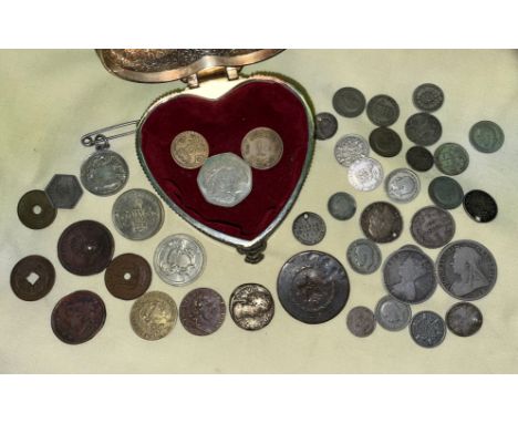 A METAL HEART SHAPED TRINKET BOX CONTAINING COINS AND TOKENS, TWO REPLICA SPADE GUINEAS, AND GB PRE-DECIMAL COINS