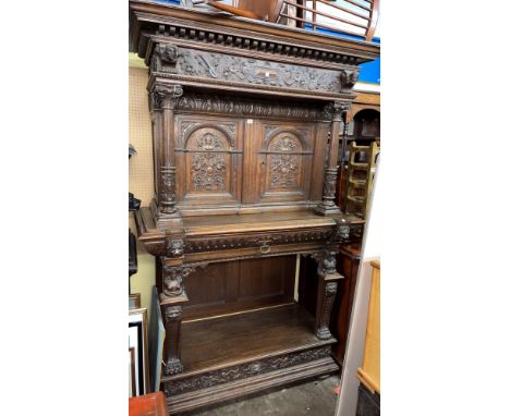19TH CENTURY CARVED OAK FRENCH STYLE BUFFET CUPBOARD CARVED WITH LIONS, FACE MASKS AND GROTESQUE