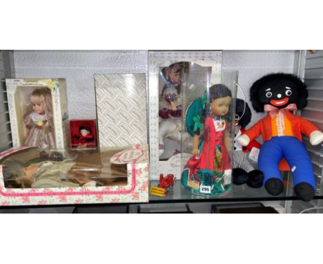 SHELF OF LEONARDO AND ALBERON PORCELAIN HEADED DRESS DOLLS, TWO FELT SOFT DOLL TOYS AND A DIE CAST MASSEY FERGUSON COMBINE HA