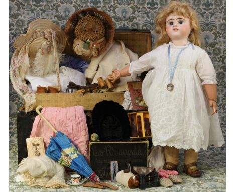 An Etienne Denamur (France) bisque head and painted composition bodied Bébé doll, the bisque head with inset fixed blue glass