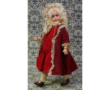 A Limbach Porzellanfabrik (Germany) bisque head and painted composition bodied walking doll, the bisque head with weighted sl