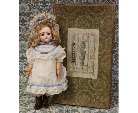 A late 19th century/early 20th century French bisque head and painted composition bodied automaton walking doll, the bisque h