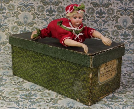 A Simon &amp; Halbig (Germany) bisque head 'Ondine' automaton swimming doll, the bisque head with fixed blue glass eyes, pain