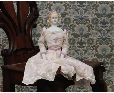 A 19th century unglazed Parian type shoulder head portrait doll, probably Empress Eugénie of France, unmarked but attributed 
