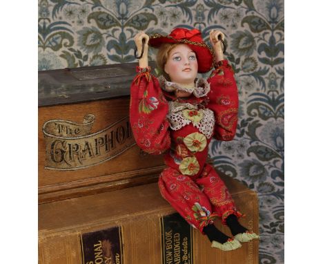 An early 20th century A.Lanternier et Cie (Limoges, Paris) bisque head automaton, as the Acrobat, the pale bisque head with p