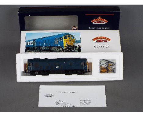 Bachmann - A boxed Bachmann OO gauge #32-428 Class 24 Diesel Locomotive Op.No.D5087 in Blue BR livery. Model appears to be in