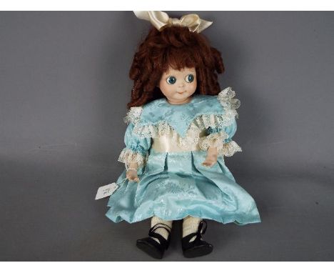 J.D.Kestner Doll - J.D.K. - a quality porcelain head doll with large round side glancing blue glass eyes (googly), painted la